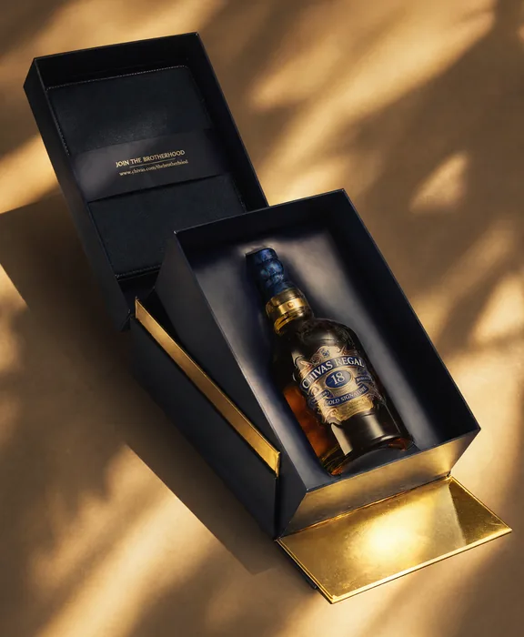 Chivas Regal 18 rigid gift box, opened to show the bottle in its gold-lined tray